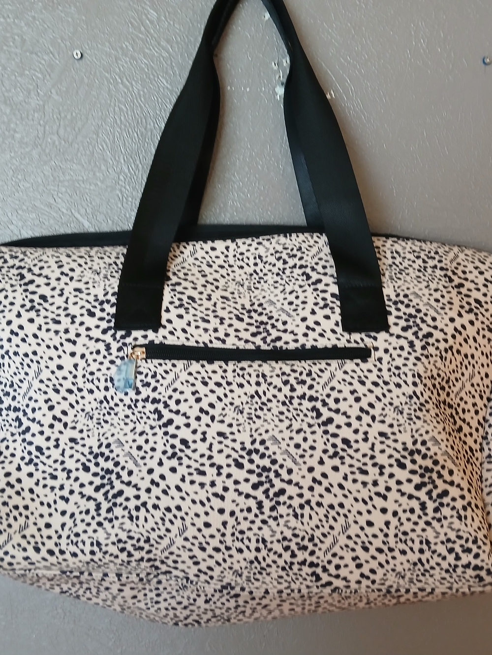 Mali + Lili weekender tote featuring a cream and black abstract animal print